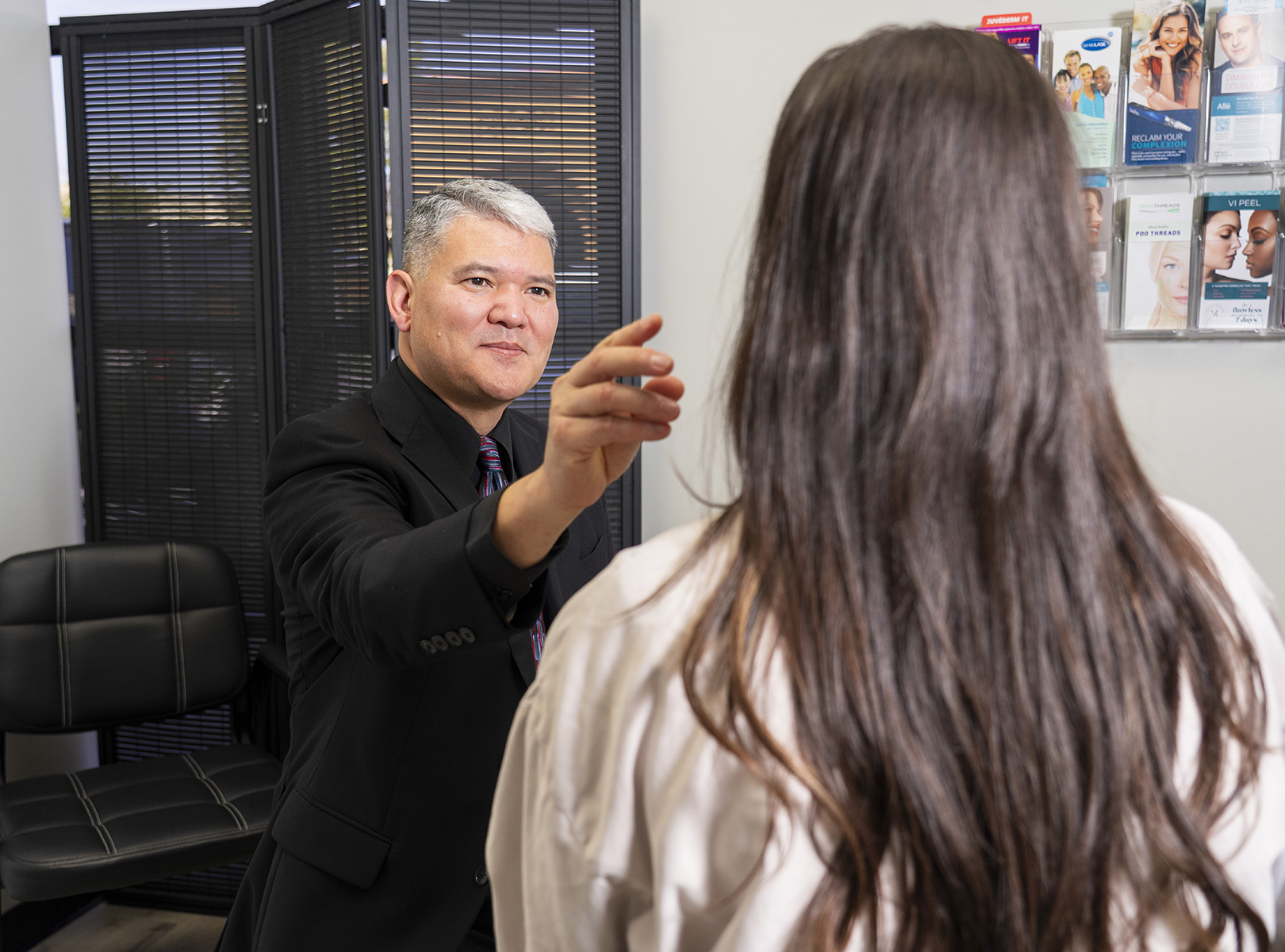 Dr. Chung with a patient