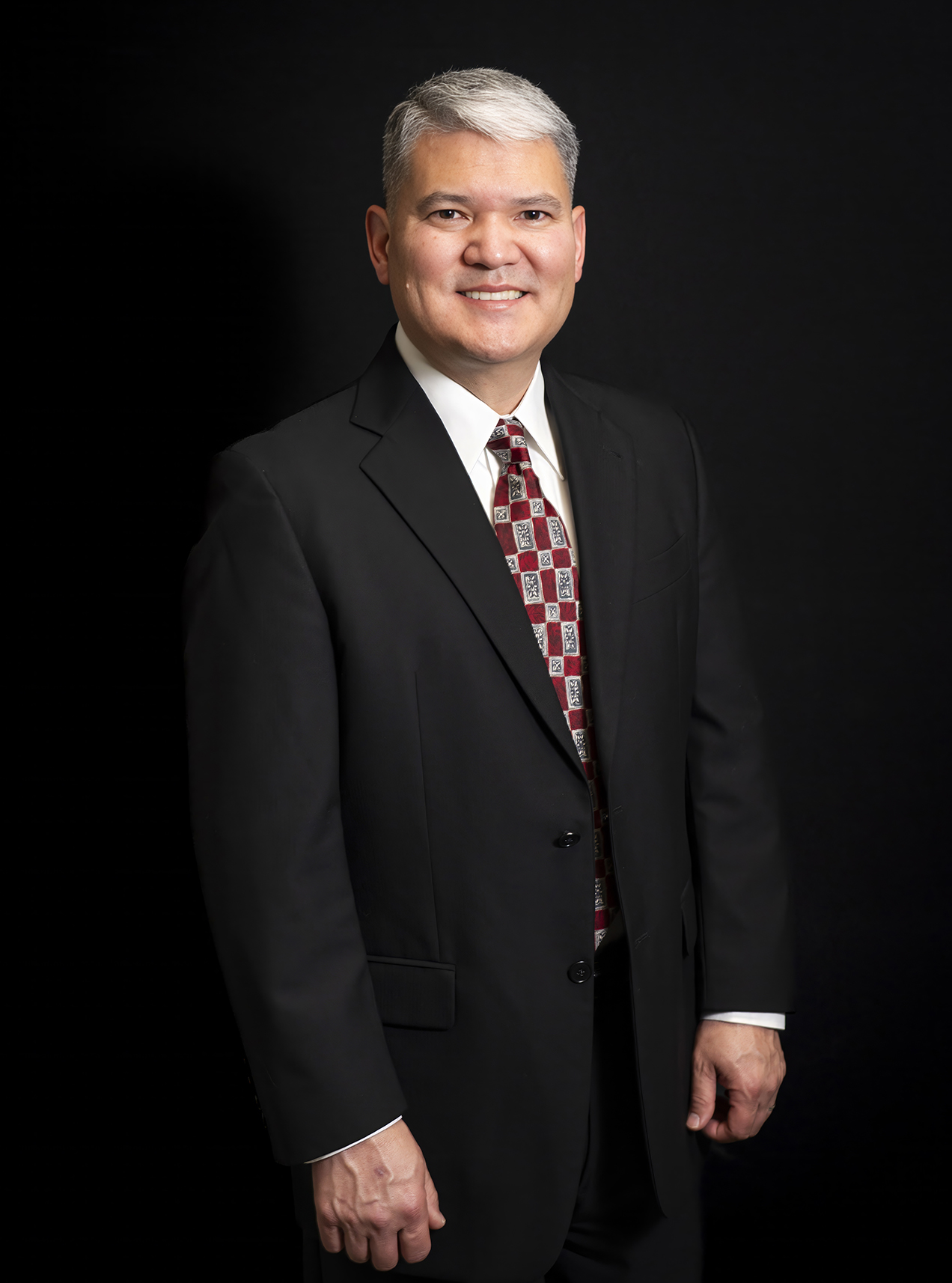 Dr. chung in a black suit