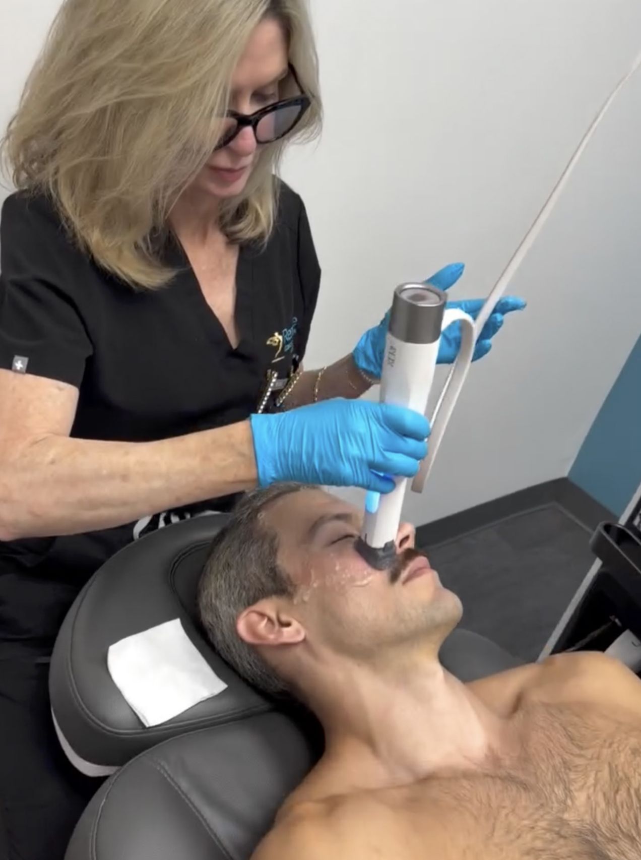 Dr. Debbie providing a XERF skin tightening RF treatment